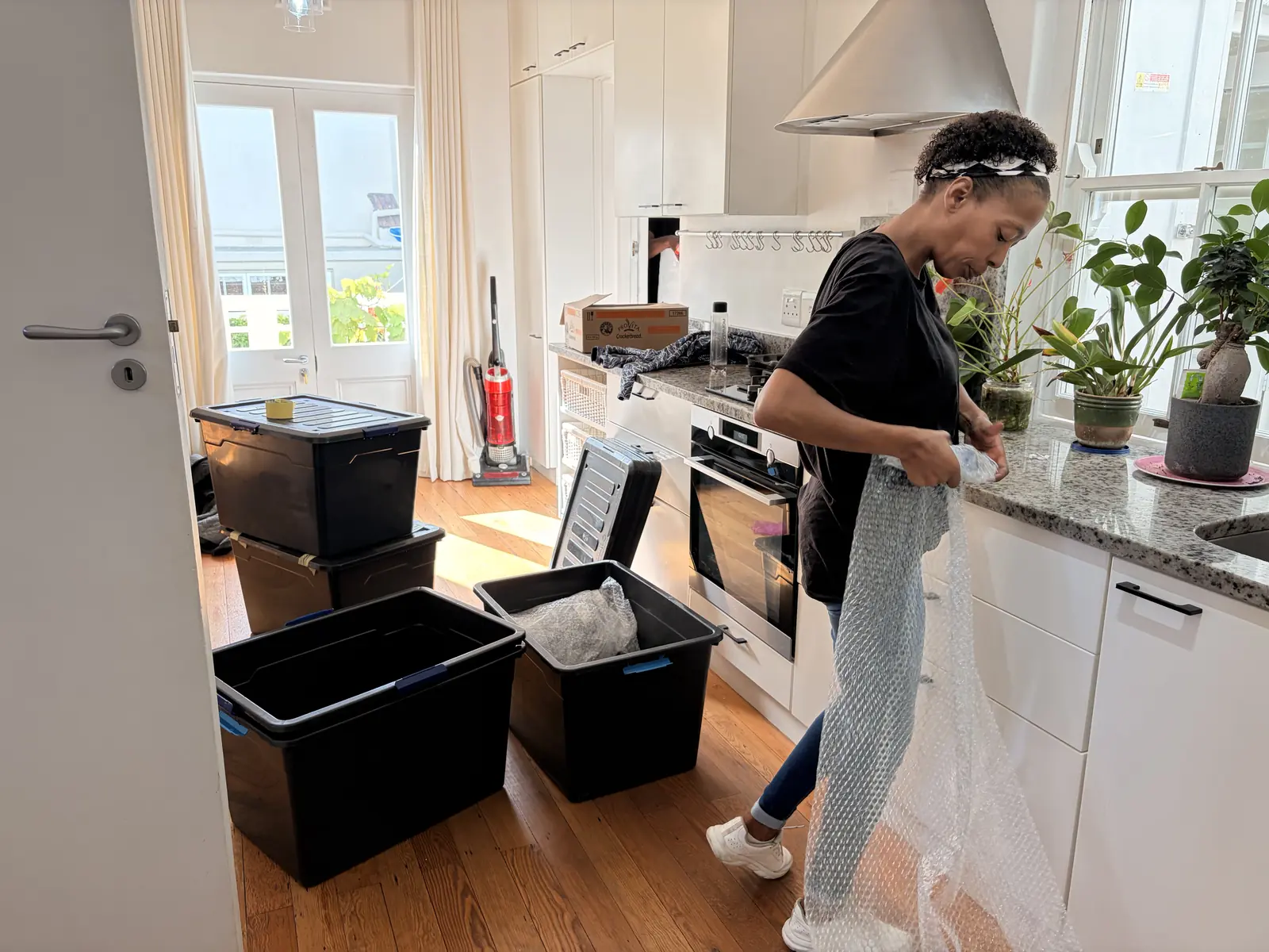 Bubble wrapping fragile kitchenware for safe transport