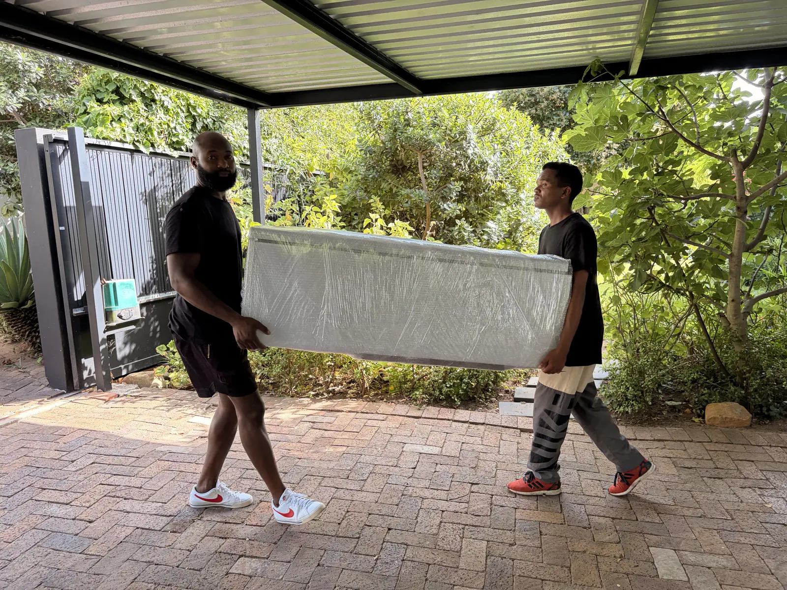 Teamwork in action: carrying large furniture